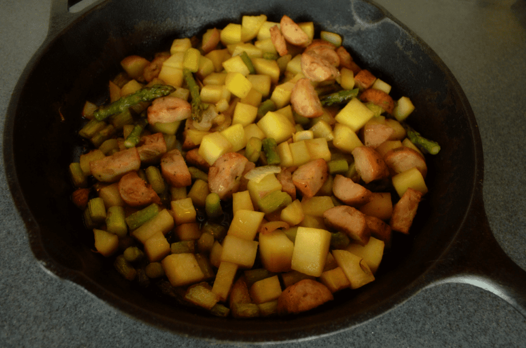 veggies and sausage in iron skillet
