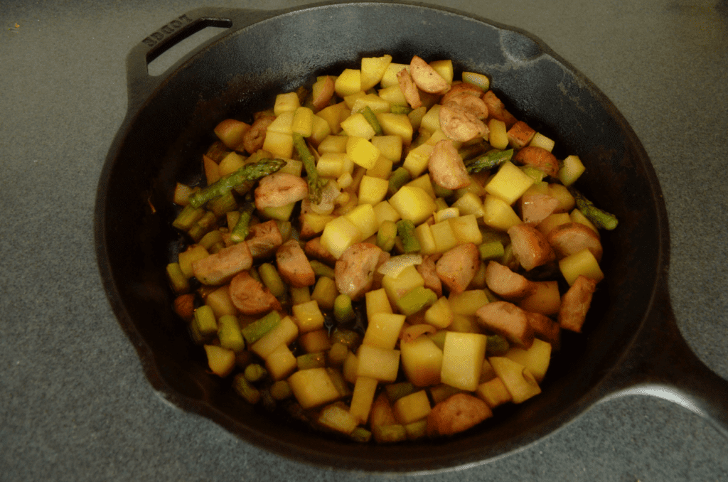 veggies and sausage finished in iron skillet