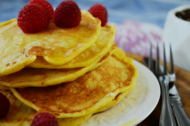 FLuffy EInkorn Buttermilk Pancakes made with ancient grains sit in a tall pile ready to eat