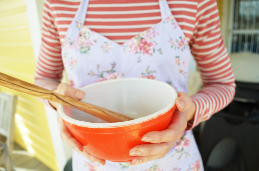 a bowl for einkorn flour is held ready to start baking. How to bake with einkorn flour? We will learn.