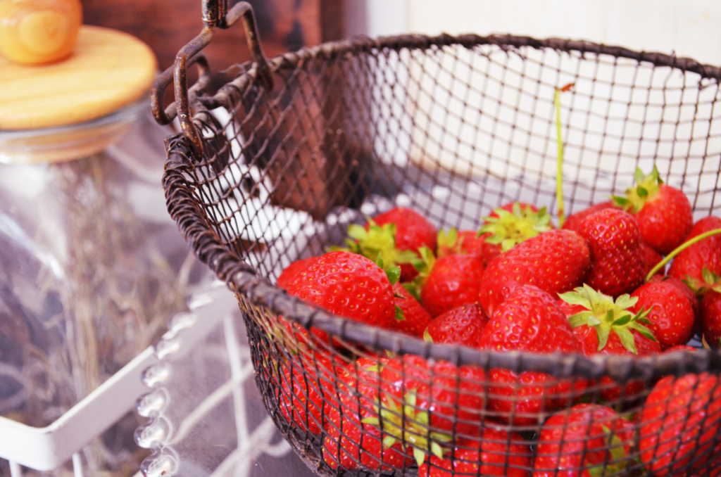 A basket of strawberries wait to be chopped for making this einkorn strawberry scone recipe