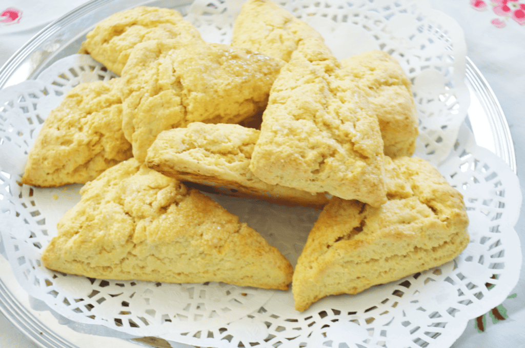 Einkorn flour Sugar topped scones are piled on a silver platter ready to serve.