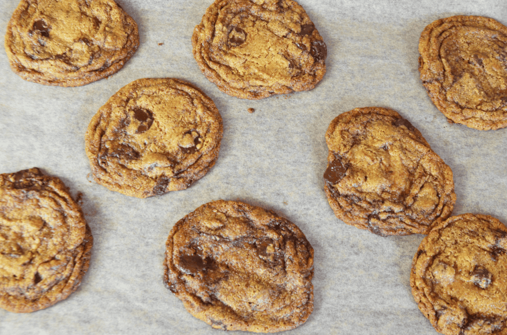 Overhead view of chewy whole wheat einkorn chocolate chip cookies fresh form the oven.