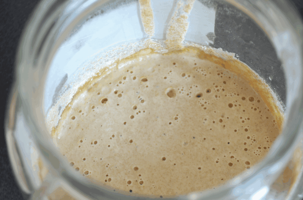 sourdough starter that is bubbly, in a glass jar