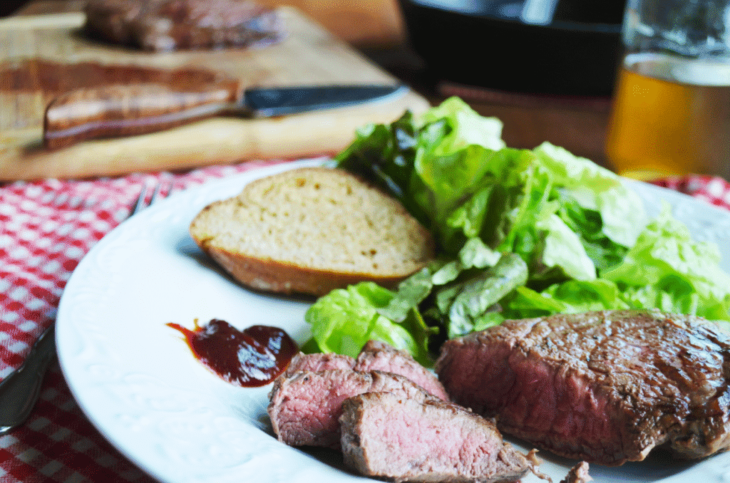 steak baked in a cast iron skillet on a plate